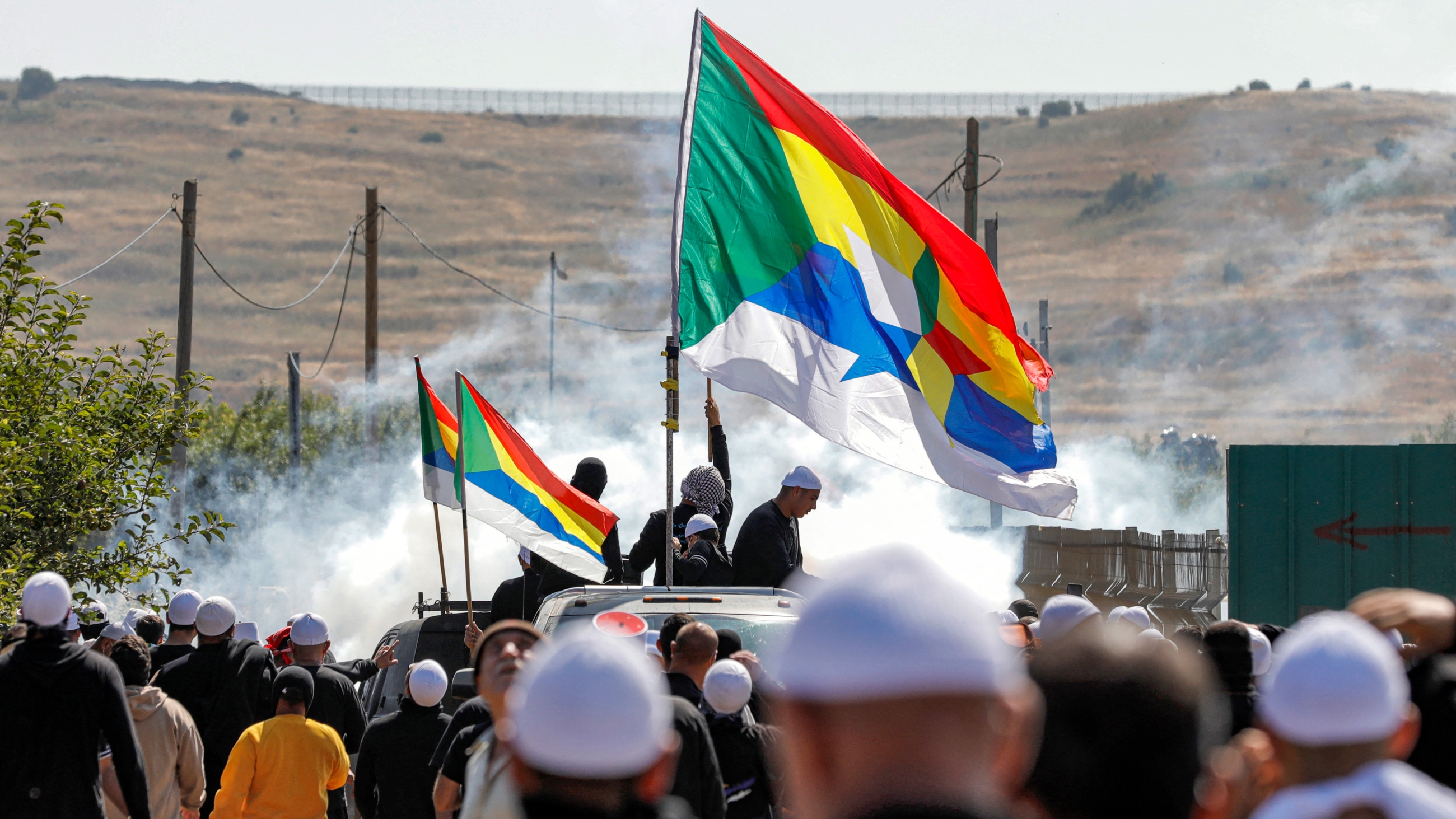 Members of the Druze community protest the Israeli wind turbine project reportedly planned in agricultural lands in their village of Majdal Shams in the Israel-occupied Golan Heights on 21 June 2023 (AFP)