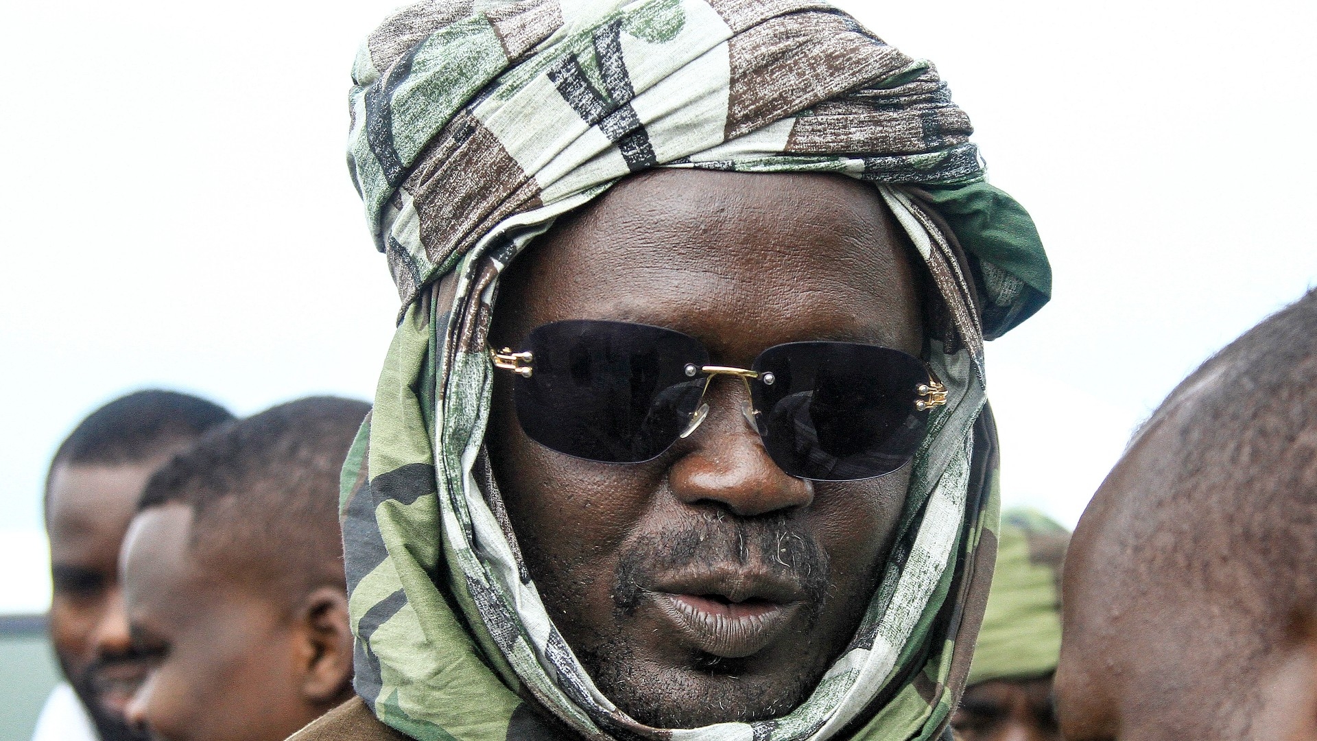 Minni Minnawi, governor of Sudan's Darfur, looks on during a stopover in the eastern city of Gedaref while on his way to Port Sudan on 30 August (AFP)