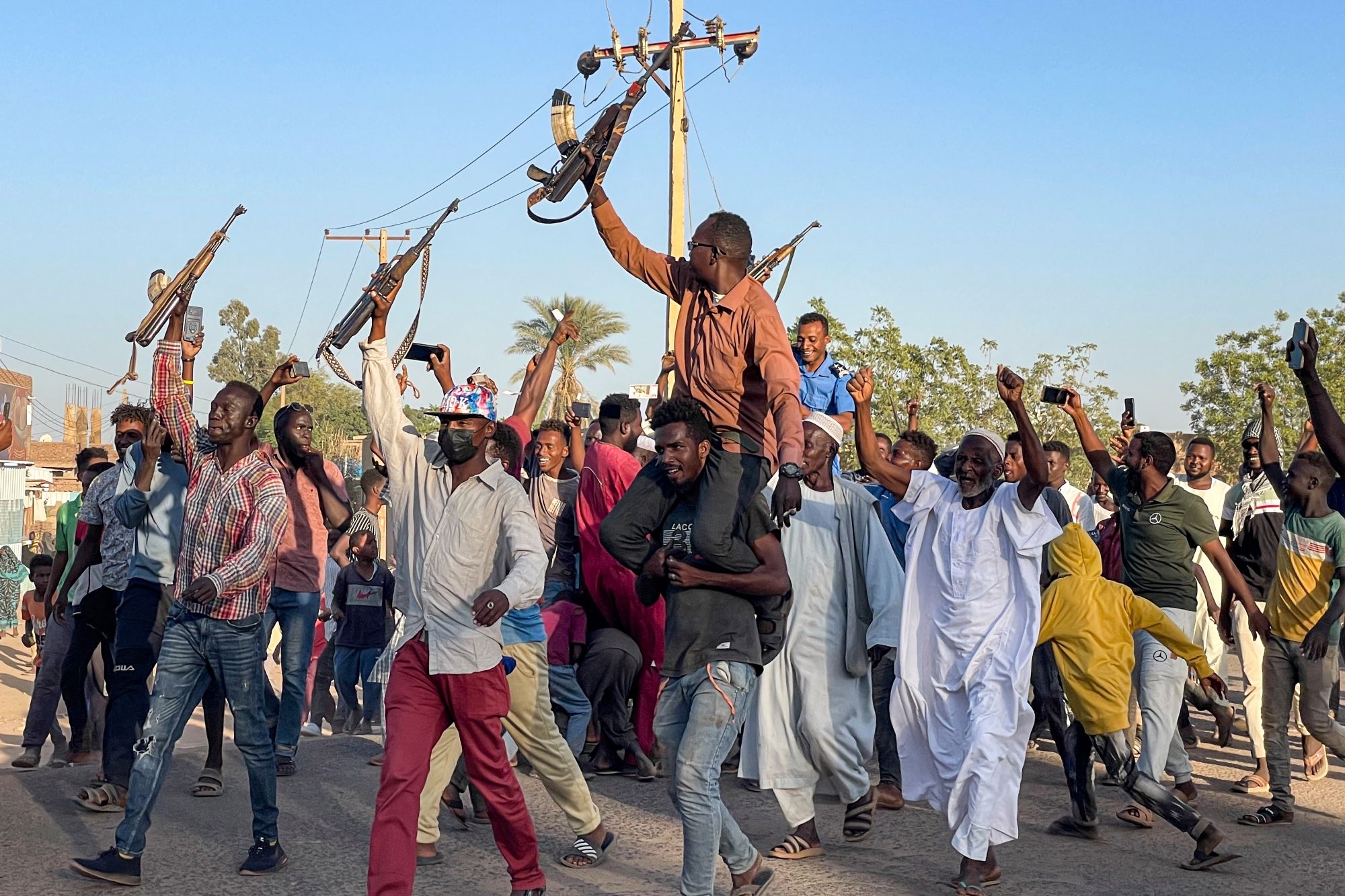 People rally in support of Sudan's army in Wad Madani on 17 December 2023, amid the ongoing war against the paramilitary Rapid Support Forces (AFP)