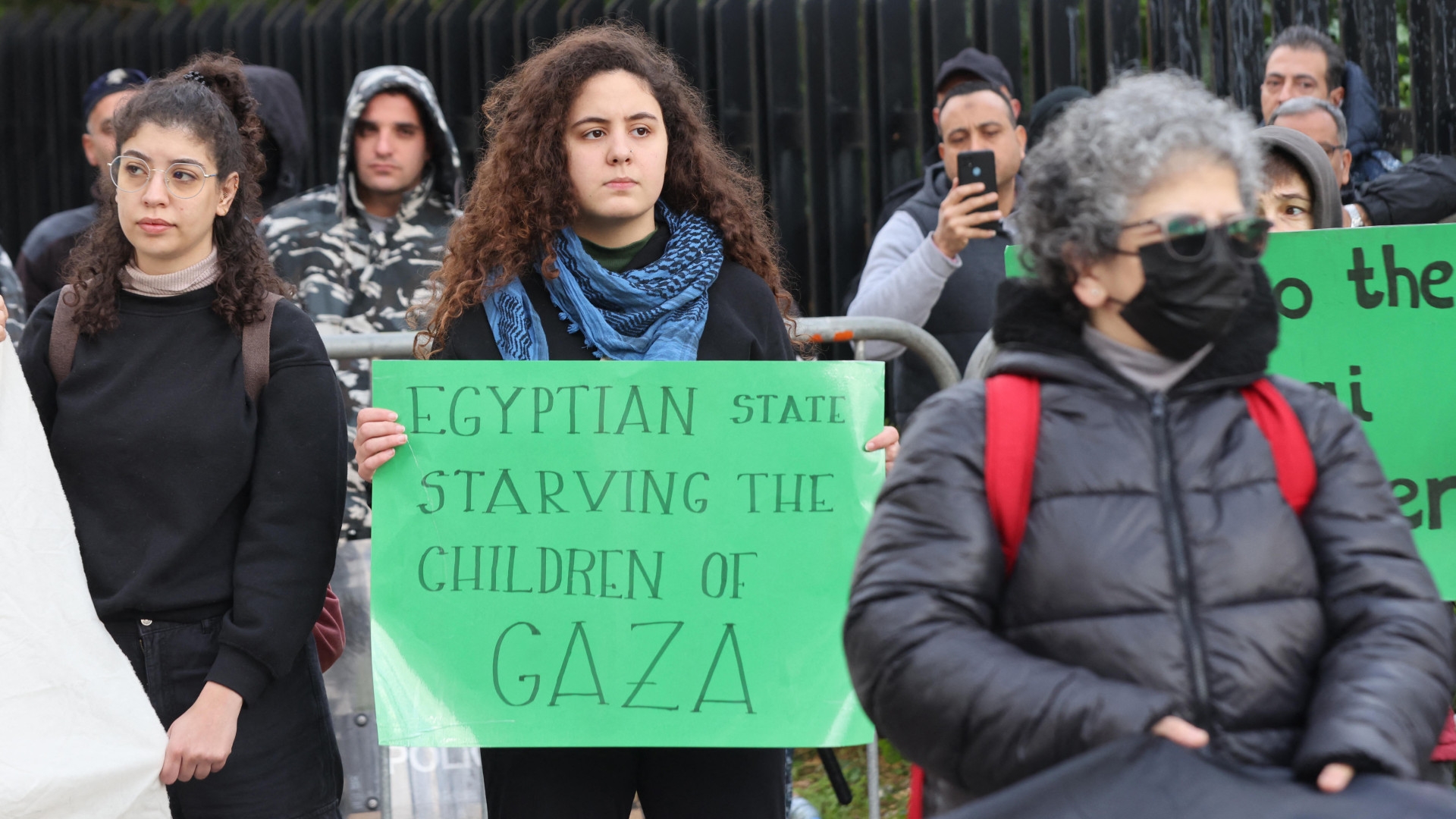 Lebanese activists block the road leading to the Egyptian embassy in Beirut in protest against the closure of the Rafah crossing between Egypt and the Gaza Strip on 19 February 2024 (Anwar Amro/AFP)