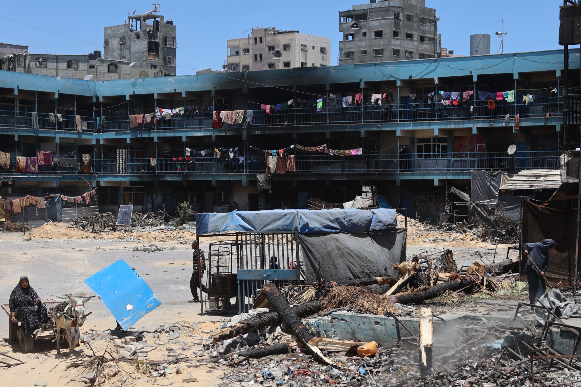 Blackened walls of a school housing internally displaced Palestinians in the Jabalia refugee camp following an Israeli raid in the Gaza Strip on 1 June 2024 (AFP/Omar al-Qattaa)