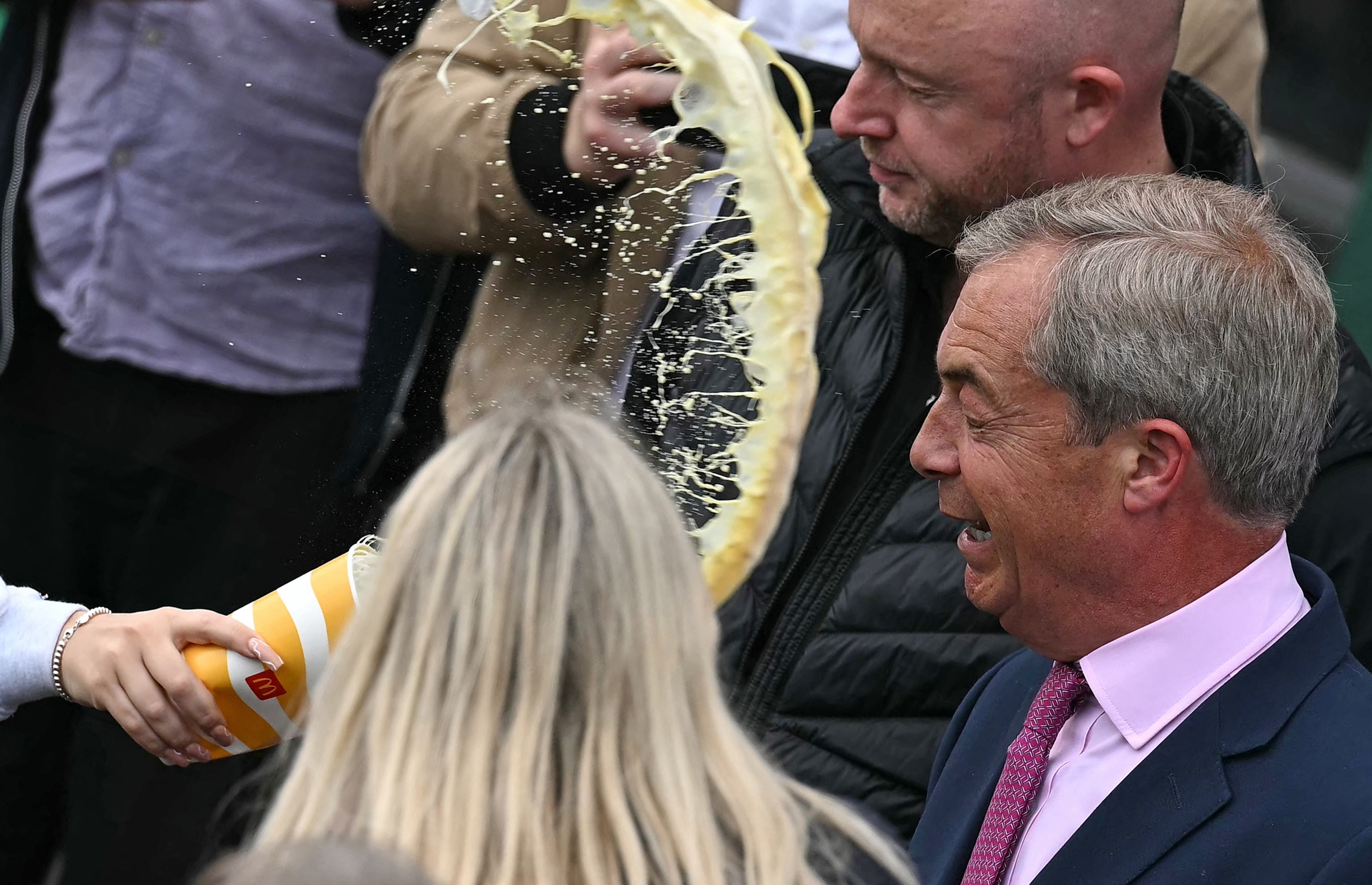 A milkshake is thrown at Nigel Farage after his campaign launch (AFP/Ben Stansall)