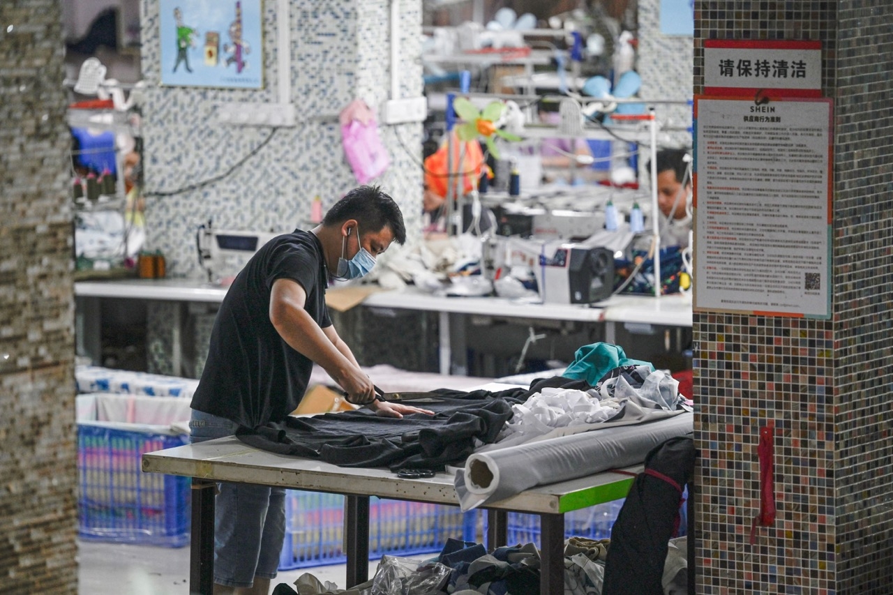 Workers produce garments at a textile factory that supplies clothes to Shein in Guangzhou in southern China's Guangdong province on 11 June 2024 (AFP/Jade GAO)