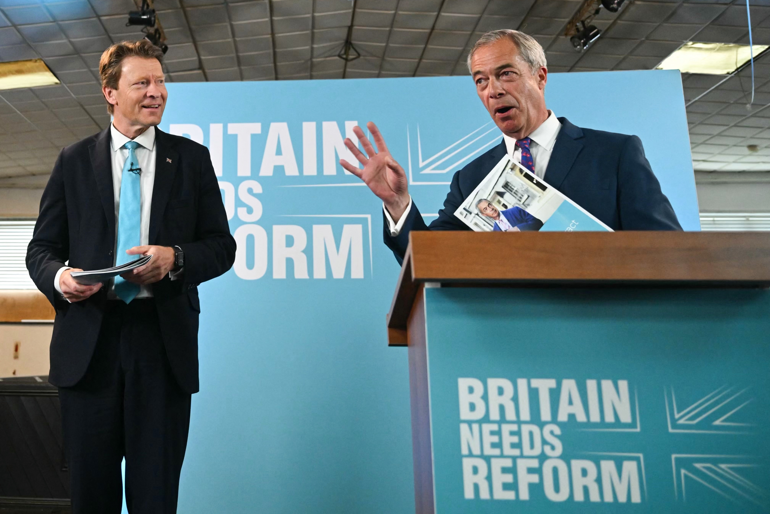 Reform UK leader Nigel Farage (right) and party chairman Richard Tice (left) at a campaign event (AFP)