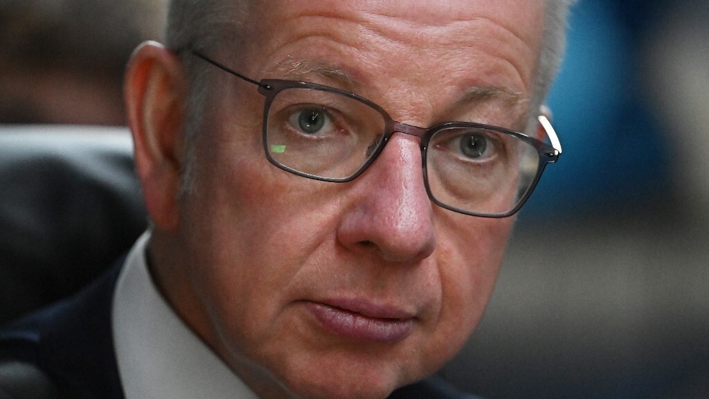 Michael Gove on the Conservative campaign bus in London on 20 June (AFP)