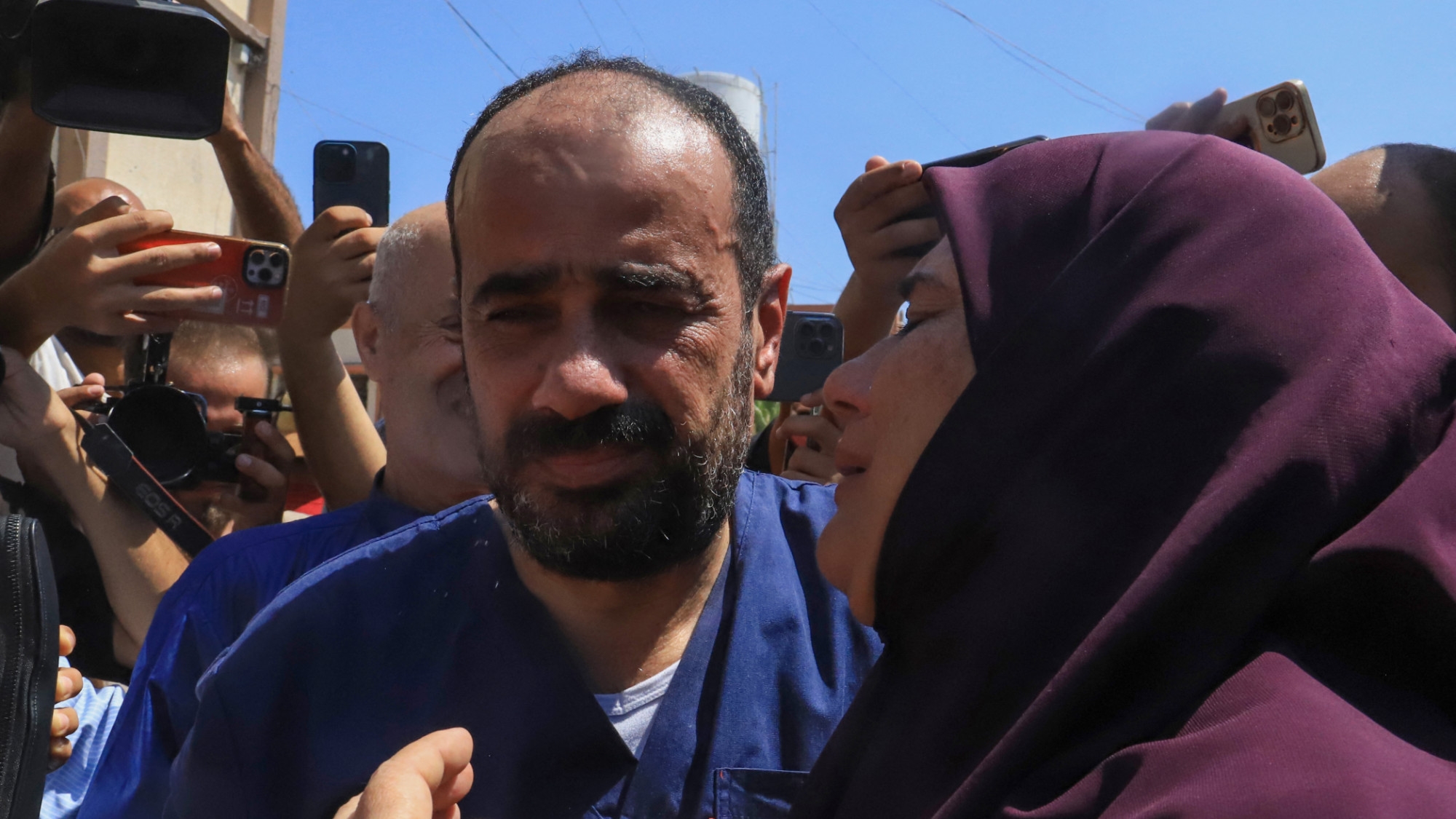 Al-Shifa hospital director Mohammed Abu Salmiya is welcomed by relatives after his release, at Nasser hopsital in Khan Yunis, on 1 July 2024 (AFP/Bashar Taleb)