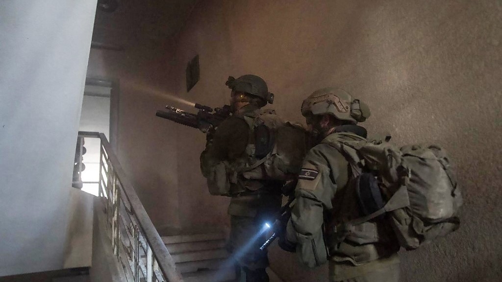  Israeli soldiers during a military operation inside a building in the Gaza Strip (AFP)