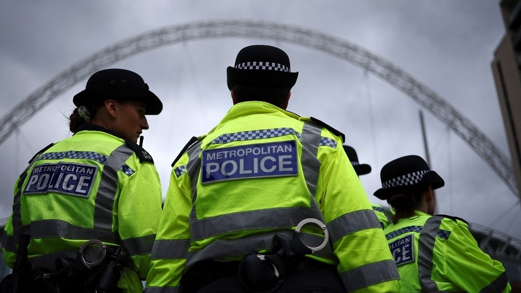 Metropolitan Police stand on duty in London (AFP)