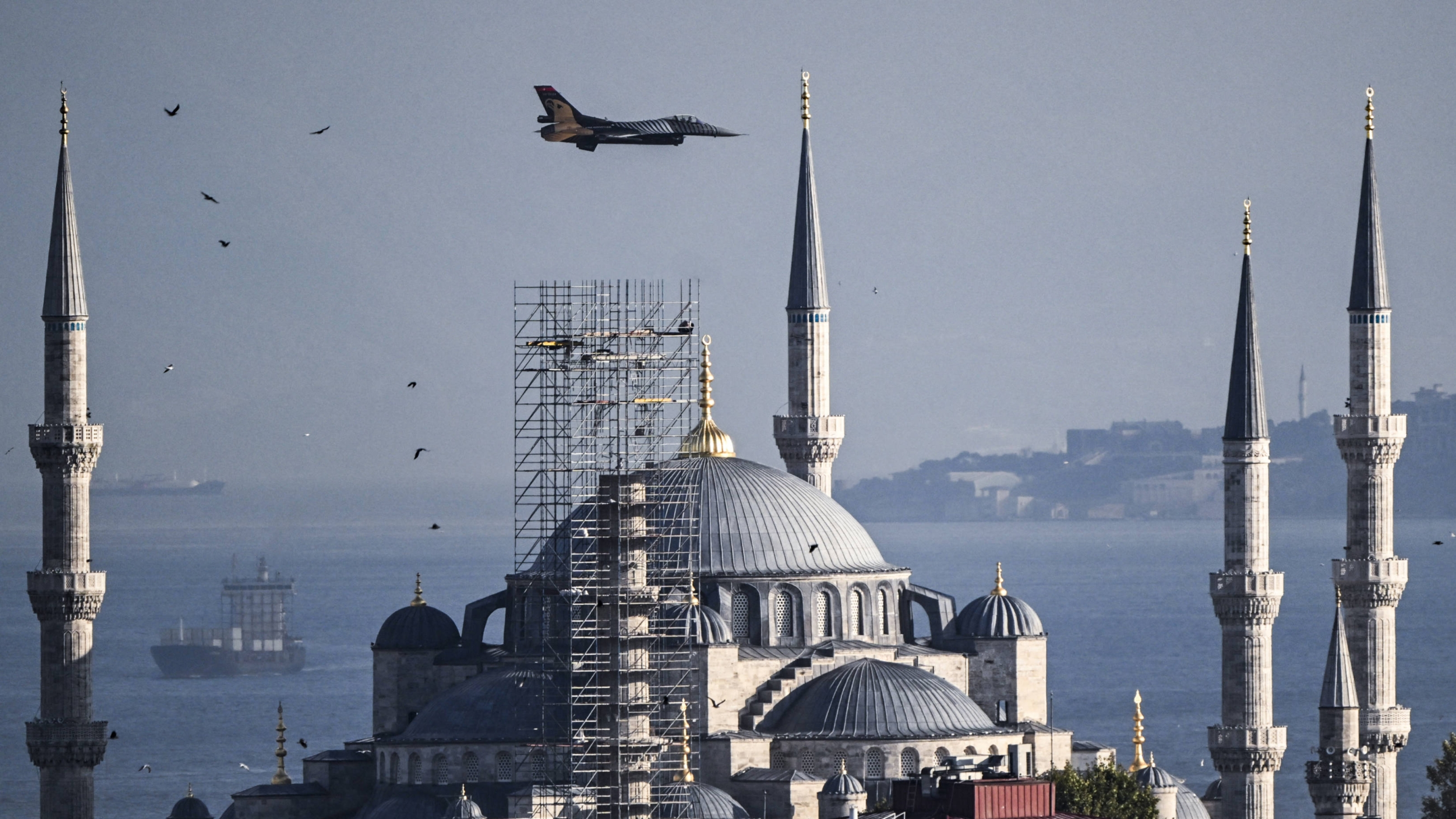 Turkish Air Force aerobatic team SOLOTURK performs a demonstration flight over Istanbul's Sultanahmet Mosque on 30 August 2024 (Kemal Aslan/AFP)