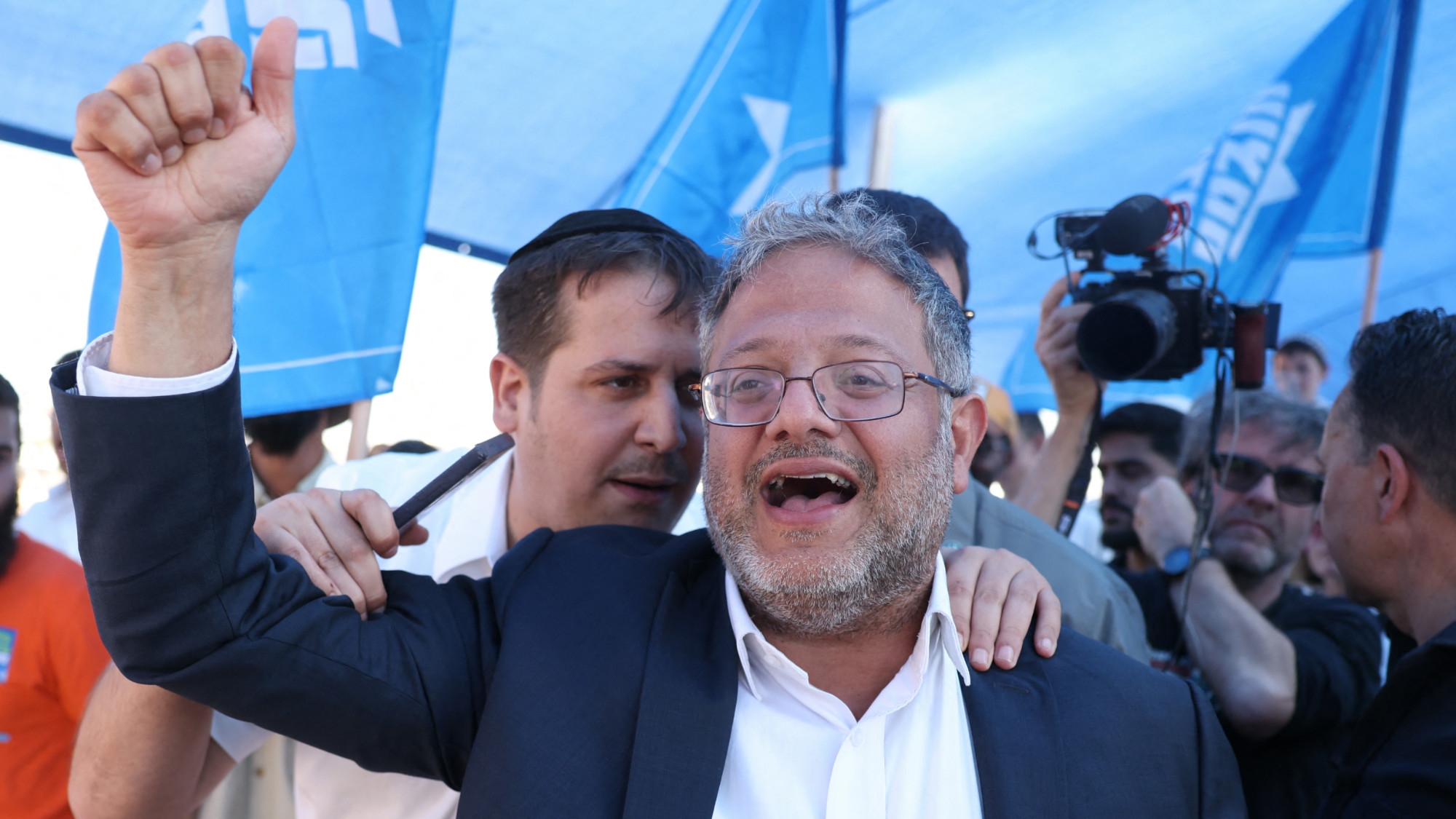 Israeli far-right minister Itamar Ben Gvir attends a gathering by right-wing activists near the border with Gaza on 21 October 2024 (AFP/Menahem Kahana)