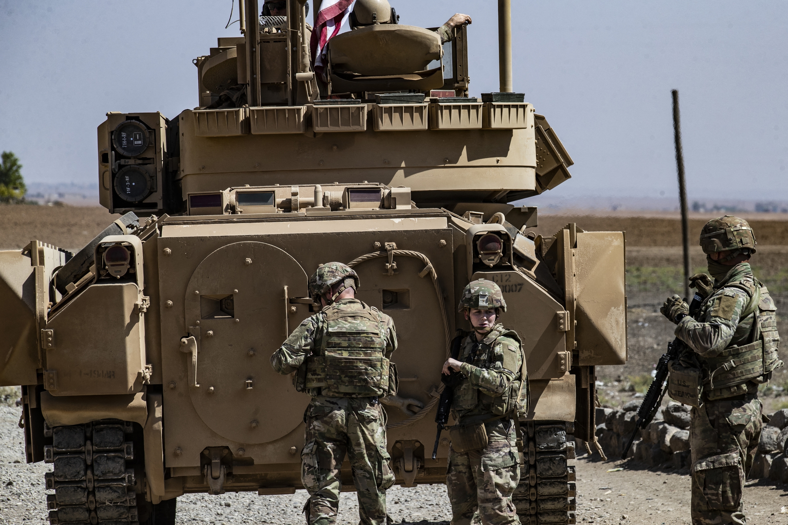 US soldiers patrol in the Syrian village of Jawadiyah