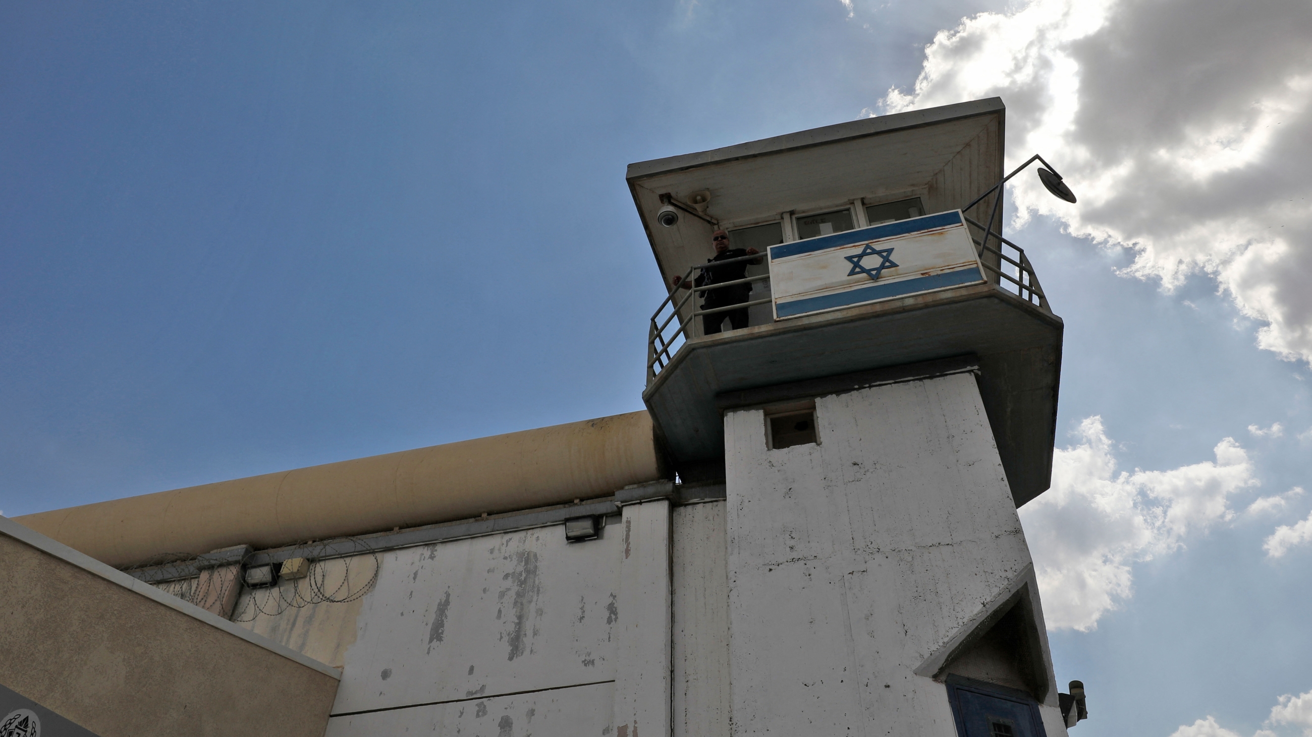 A police officer keeps watch from an observation tower at the Gilboa Prison in northern Israel on 6 September  2021 (AFP)