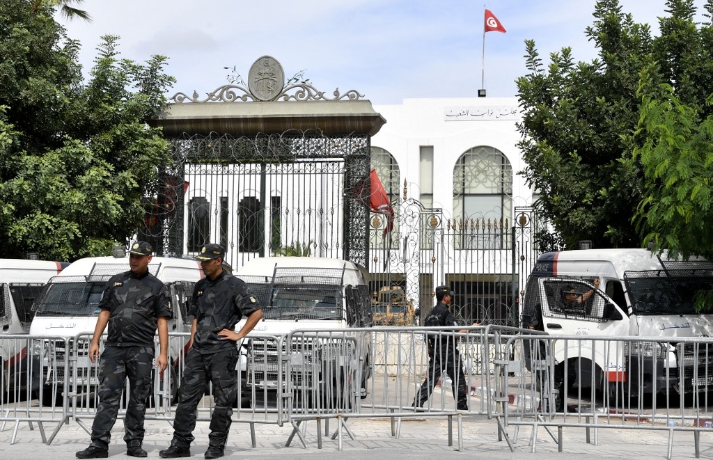 Tunisian security forces guard the entrance of the country's parliament, on 1 October 2021. (AFP)