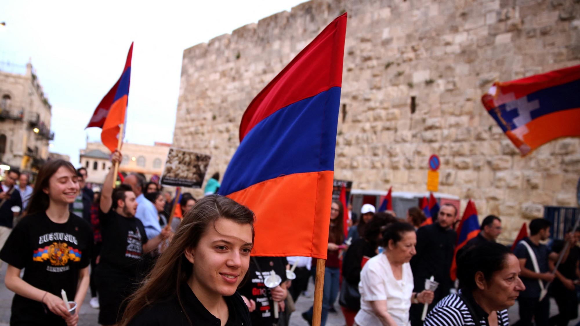 Members of the Armenian community of Jerusalem march on 23 April 2016 in Jerusalem's Old City (AFP) 