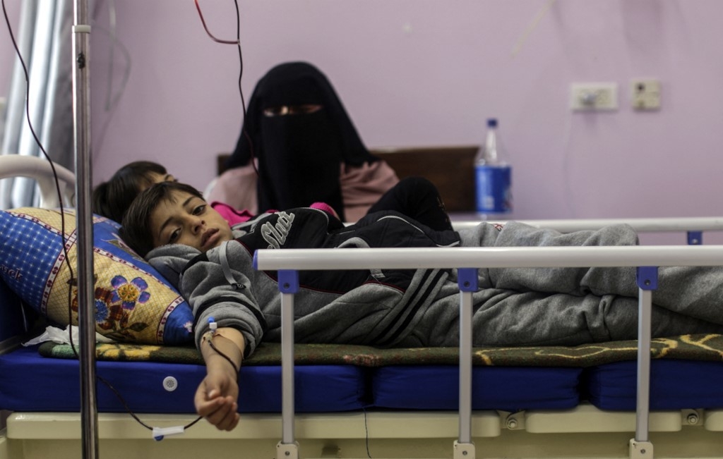 Palestinian children suffering from cancer receive treatment at a hospital in Gaza City on 13 February 2018. (AFP)