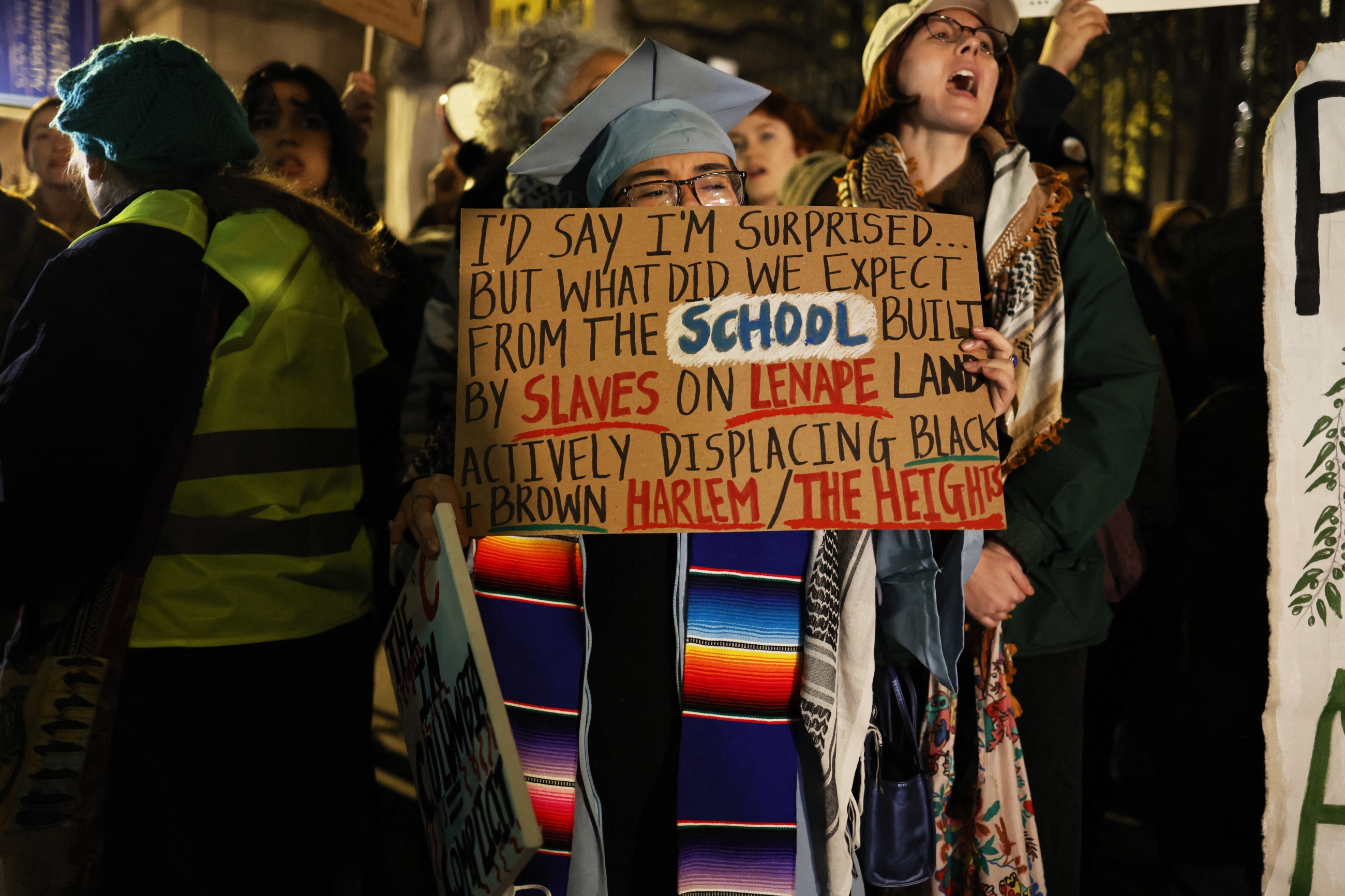 People gather to protest the banning of Students for Justice in Palestine and Jewish Voice for Peace at Columbia University on 20 November 2023 in New York City (Michael M Santiago/Getty via AFP)