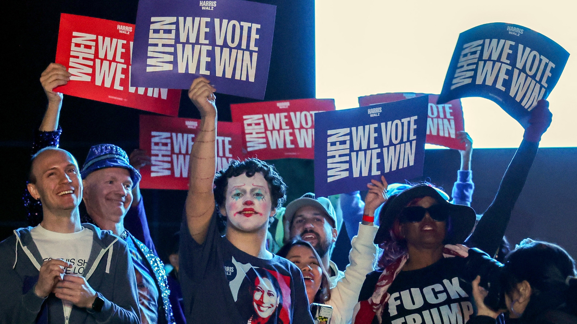 Attendees hold up signs during a campaign rally with Democratic presidential nominee and US Vice President Kamala Harris at Craig Ranch Amphitheater on 31 October 2024, in Las Vegas, Nevada (Ethan Miller/Getty Images/AFP)