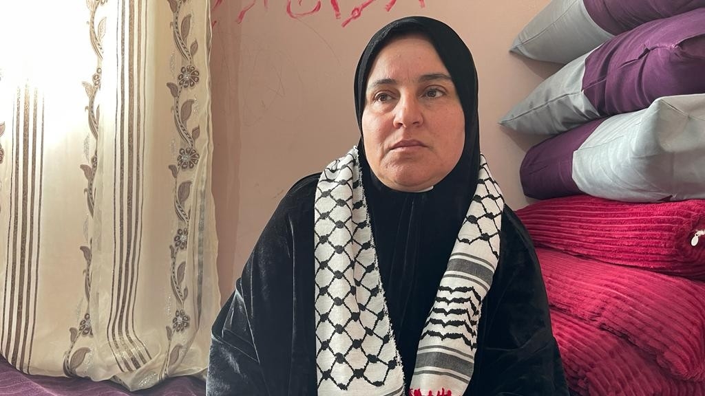 Jeenan Mefleh, the mother of Ammar Mefleh, in her home mourning her son (MEE/Akram al-Waara)