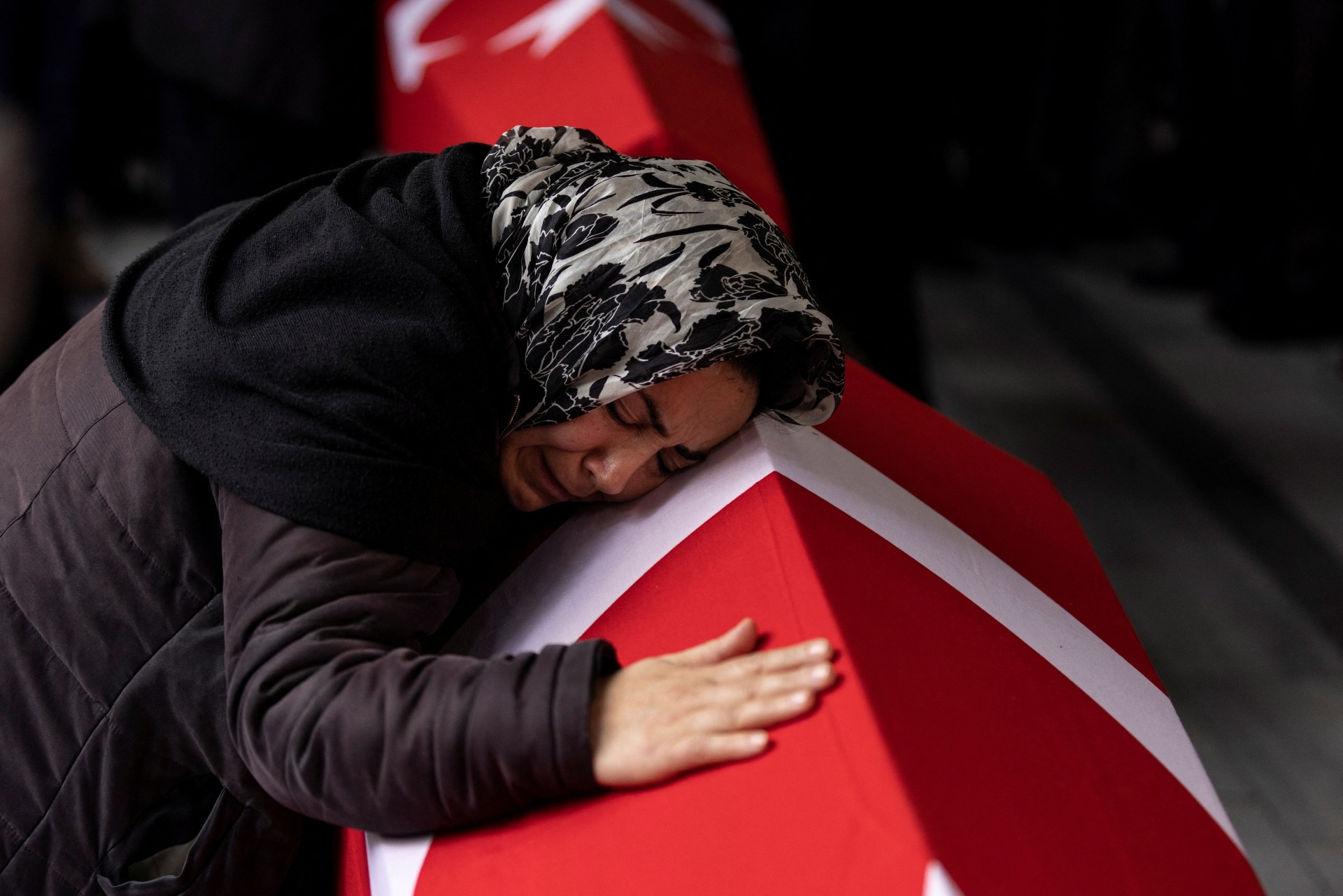 A relative of two victims of Sunday's blast mourns during their funeral ceremony in Istanbul (Reuters)