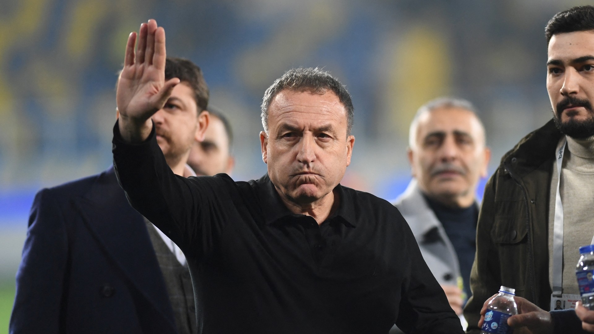 MKE Ankaragucu president Faruk Koca reacts as he leaves the field after the team's match against Caykur Rizespor on 11 December (Reuters)