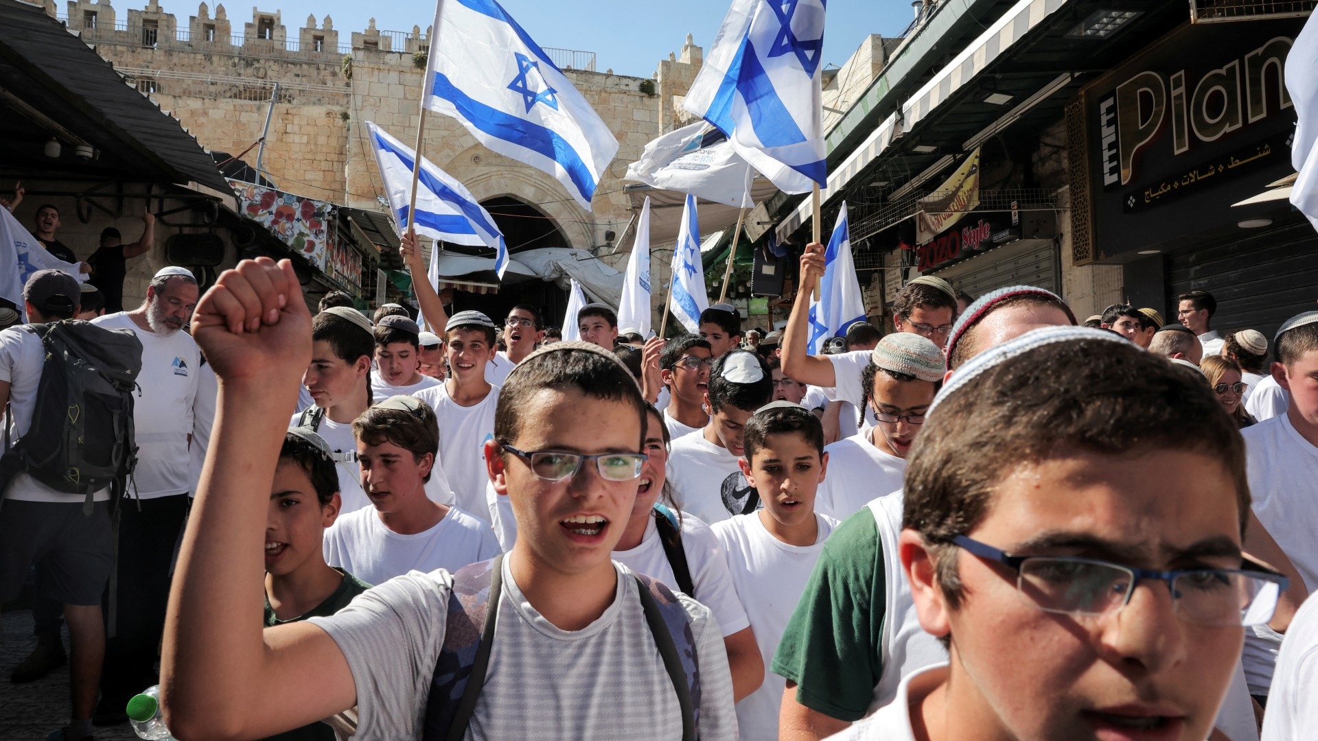 Israelis hold flags as they participate in the annual Jerusalem Day march on 5 June (Reuters/Marko Djurica)