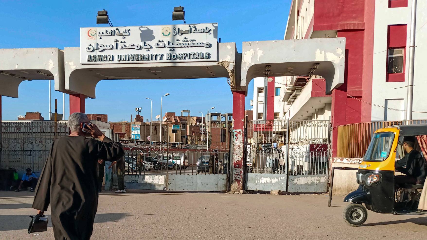 A man walks outside Aswan University Hospital in Egypt's southern city of Aswan, 13 April 2022 (AFP)