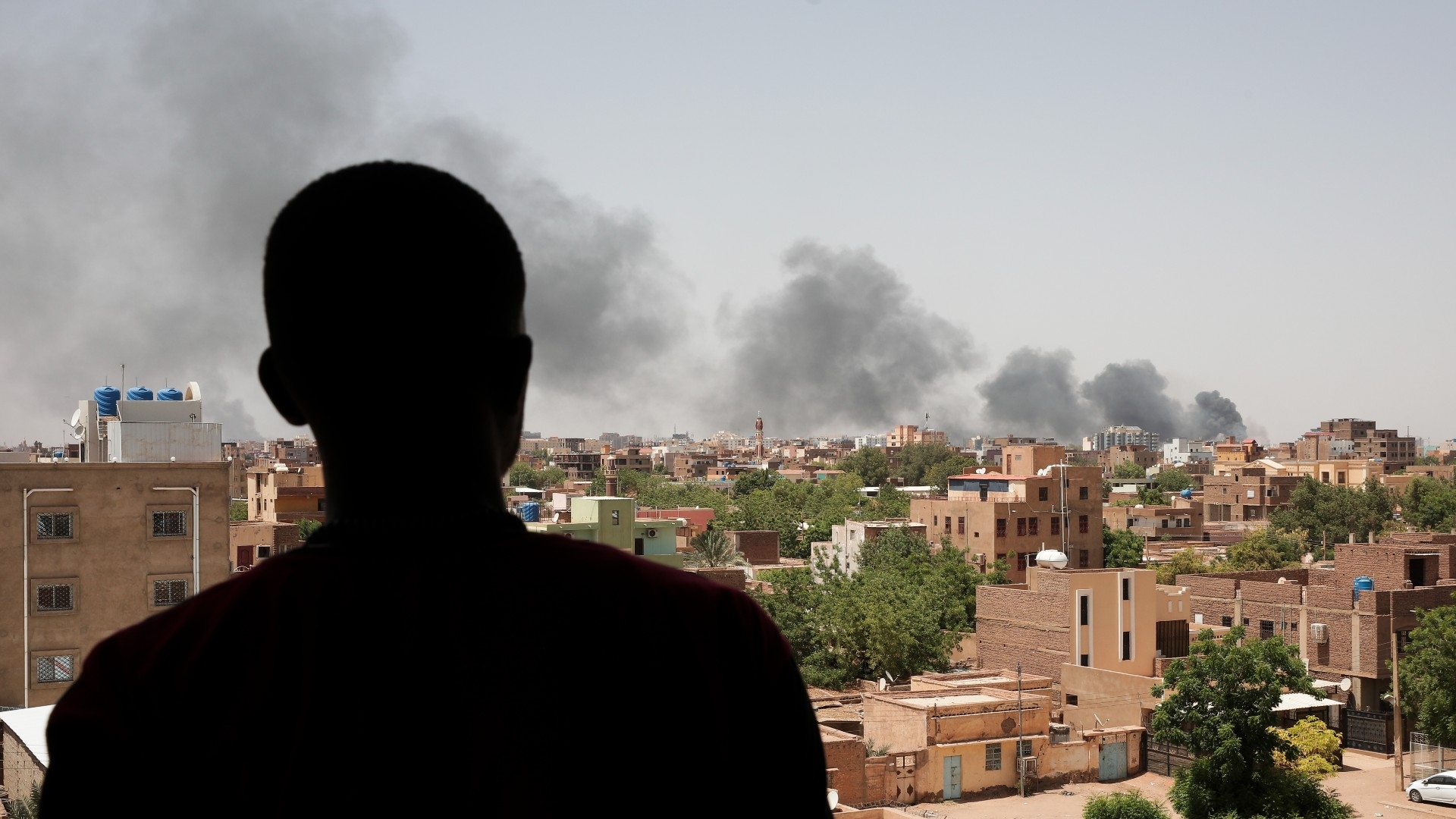 Smoke is seen in Khartoum, Sudan, 22 April (AP)