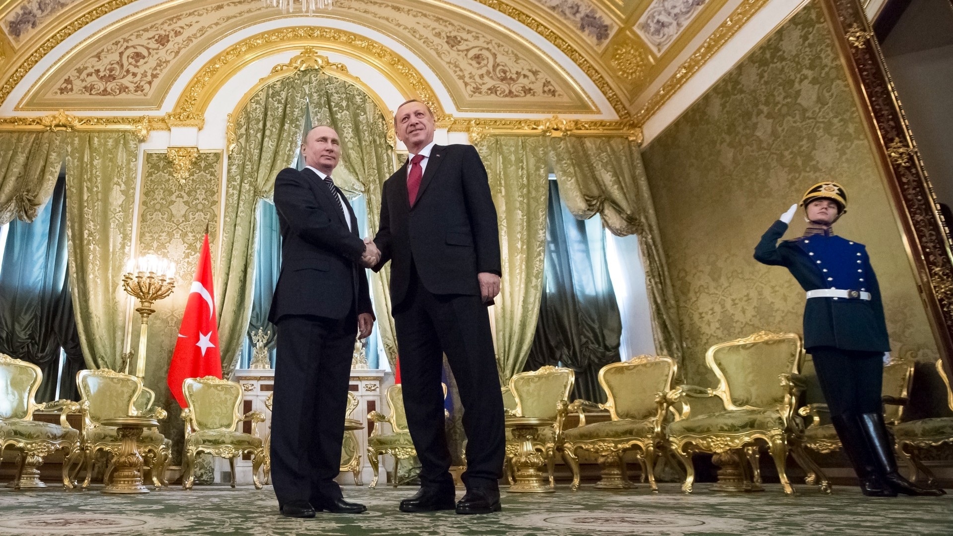 Russian President Vladimir Putin, left, shakes hands with Turkey's President Recep Tayyip Erdogan during their meeting in the Kremlin in Moscow in 2017 (AP)