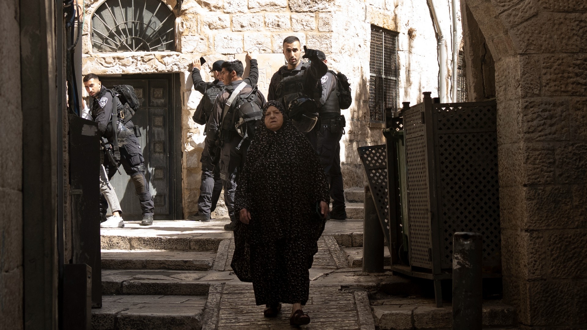 Israeli police search Palestinians amid heightened security in the Old City of Jerusalem, following an unprecedented attack by Hamas on Israel, 7 October (AP)