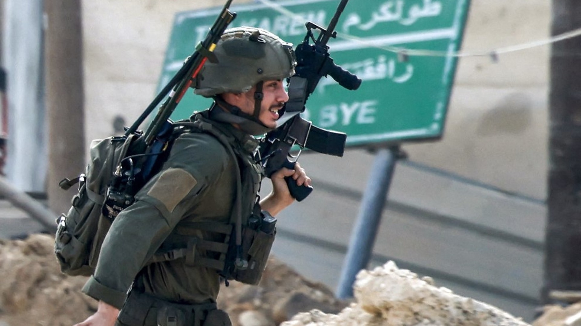 An Israeli soldier takes position during an army operation in Tulkarm in the north of the occupied West Bank on August 29, 2024 (AFP)