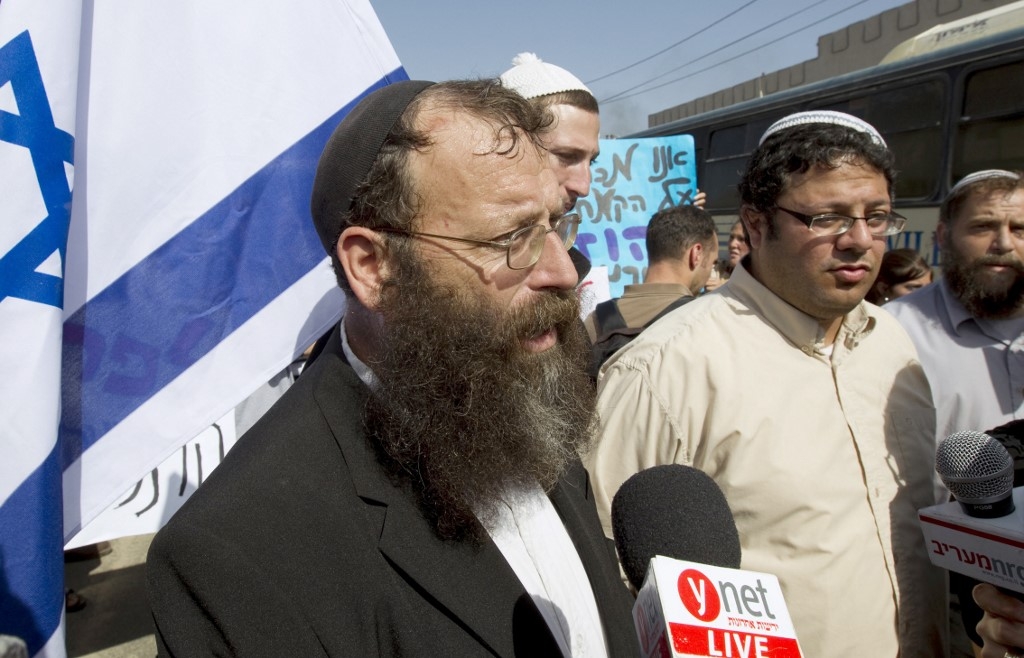 Baruch Marzel (left) and Itamar Ben Gvir (right) arrive in Umm al-Fahm on October 27 2010. Right-wing Israelis, marching under heavy police escort through the Arab town in northern Israel, were met by stone-throwing residents (Jack Guez/AFP).