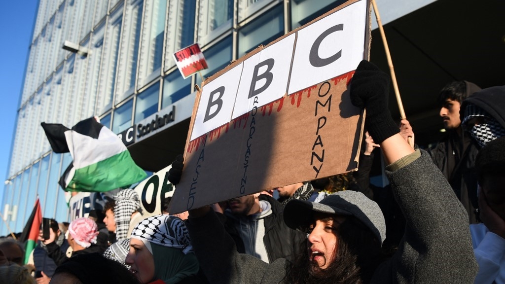 Protesters gather outside the BBC Scotland during a show of solidarity with the Palestinian people in Glasgow on 14 October (AFP/Andy Buchanan)
