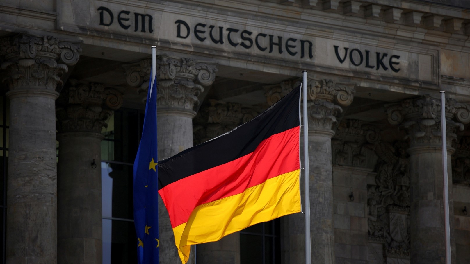 The German national flag flies in front of the Reichstag building, the seat of the lower house of the parliament Bundestag, in Berlin, Germany (Reuters)