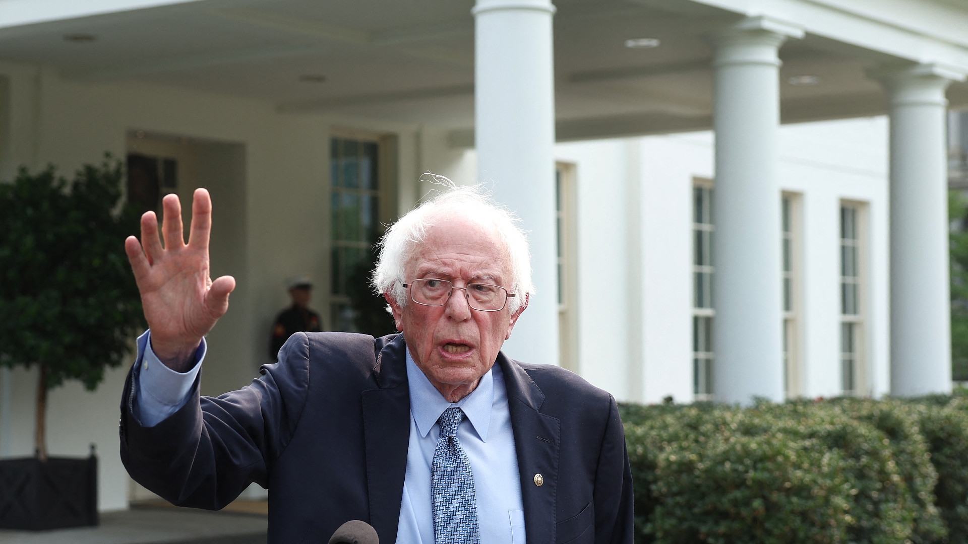 US Senator Bernie Sanders speaks to the media outside of the White House after meeting with President Joe Biden on 17 July 2023 in Washington, DC (AFP)