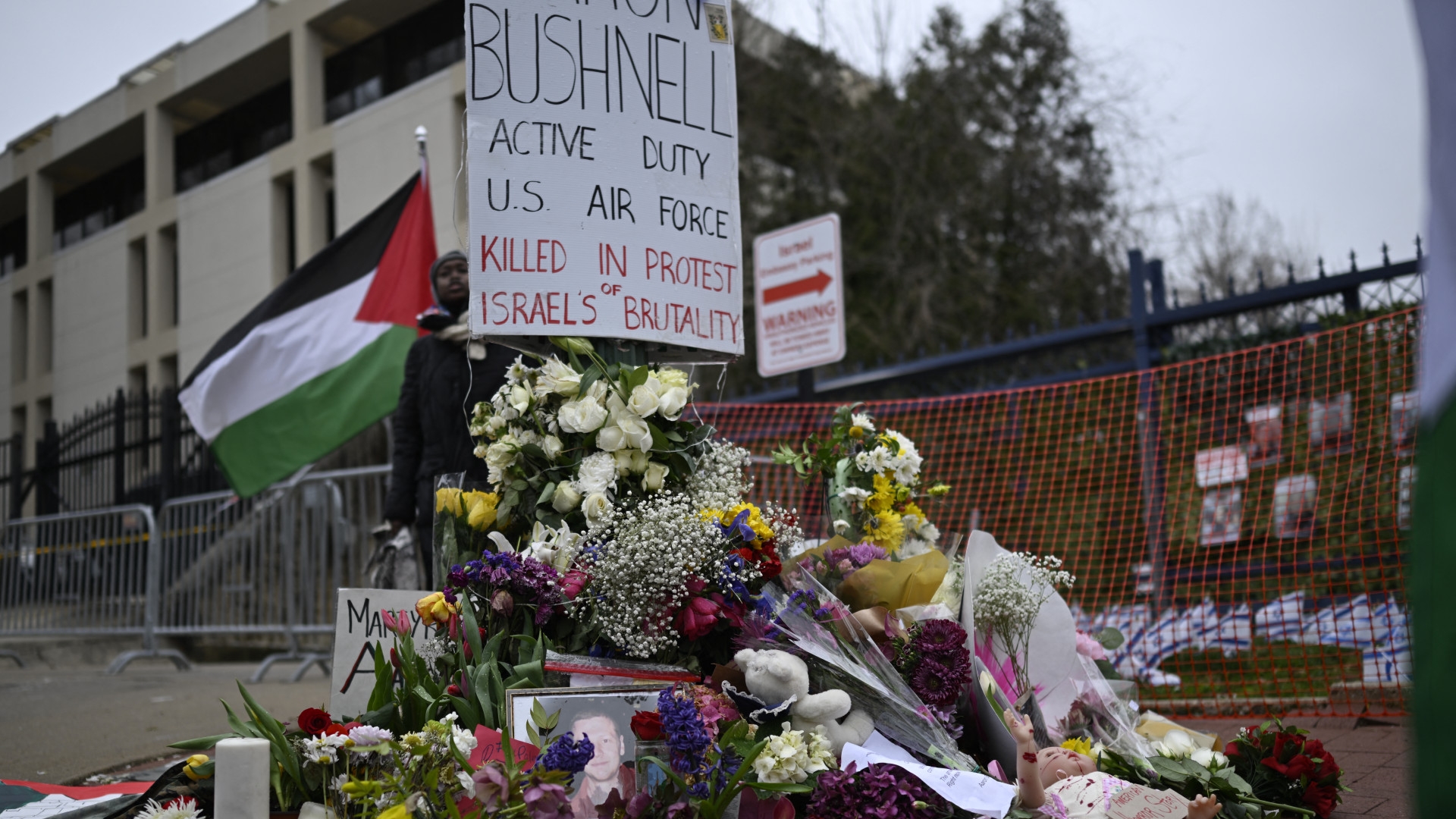A memorial to Aaron Bushnell, a member of the US military who set himself on fire last weekend in protest of Israel's genocide in Gaza, is set up near the Israeli embassy in Washington, DC, on 2 March 2024 (Andrew Caballero-Reynolds/AFP)