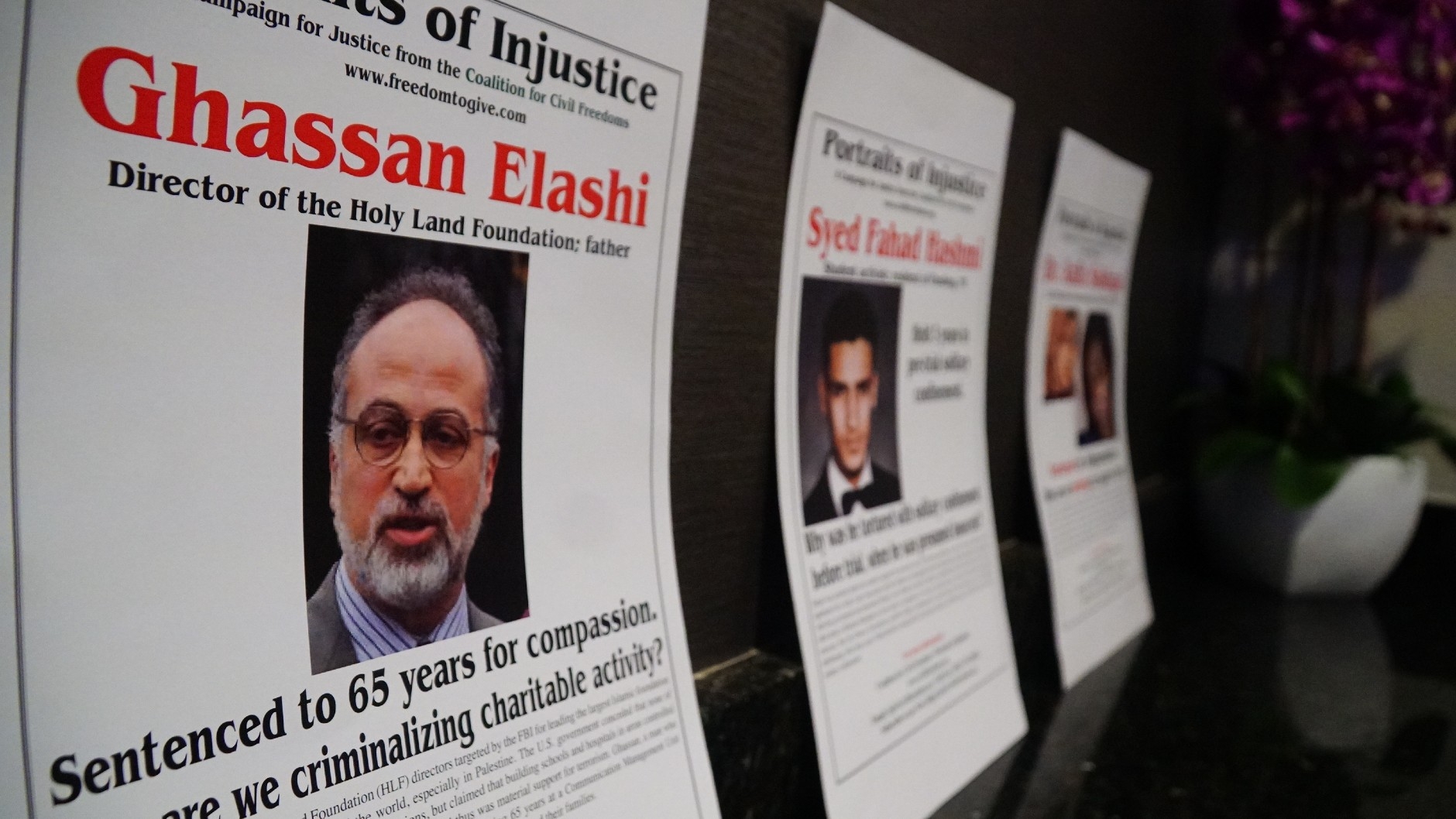 A poster describing the case of Palestinian-American Ghassan Elashi, director of the Holy Land Foundation, who was sentenced to 65 years in prison.