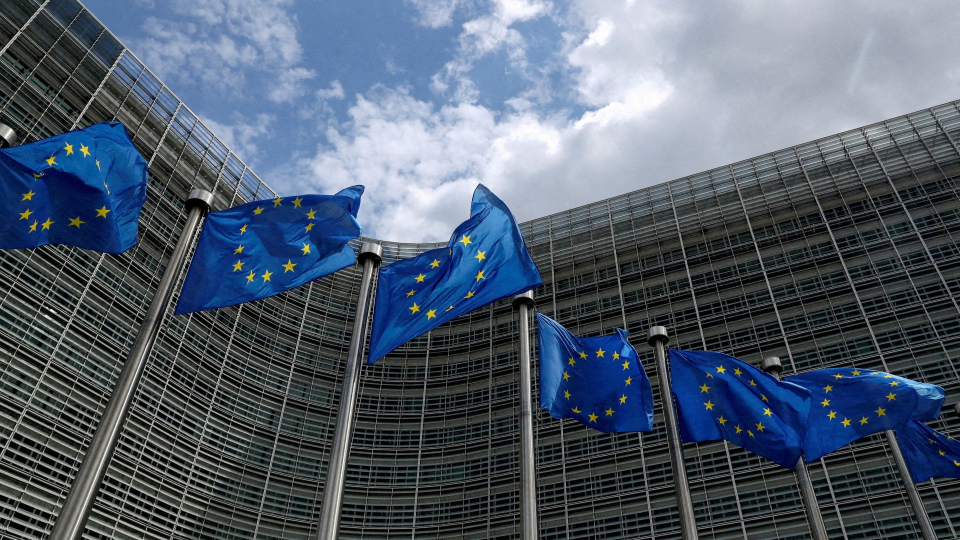 European Union flags flutter outside the European Commission headquarters in Brussels, Belgium, 5 June 2020 (Reuters)
