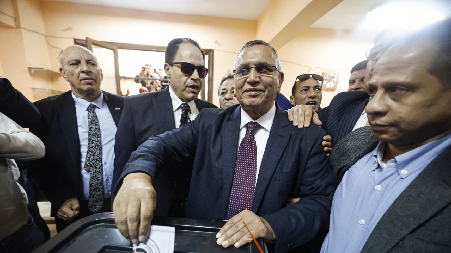 Wafd party head Abdel-Sanad Yamama (centre) said investigations were ongoing to find the truth behind the video (Khaled Desouki/AFP)