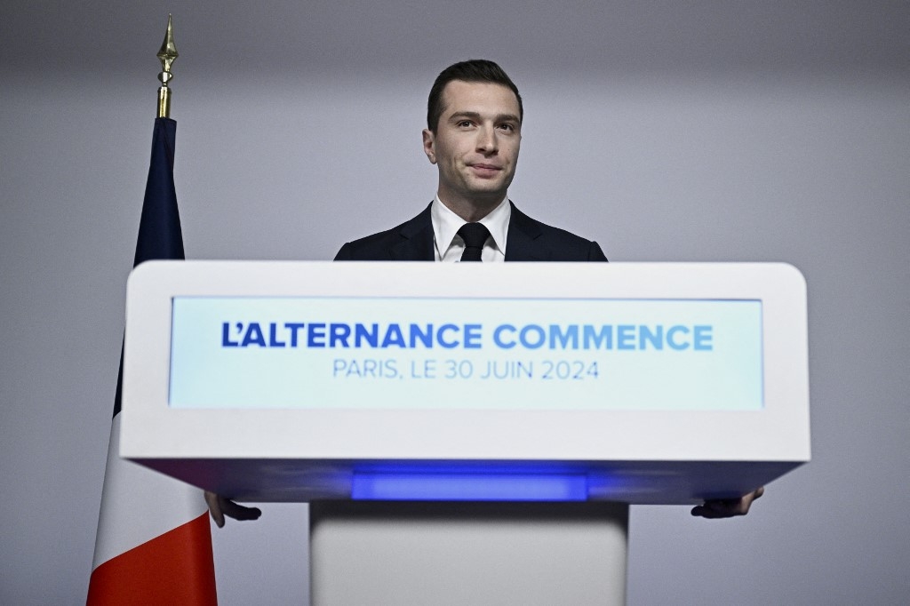 French far-right National Rally (RN) president Jordan Bardella gives a speech during the results evening of the first round of the parliamentary elections in Paris on 30 June (Julien de Rosa/AFP)