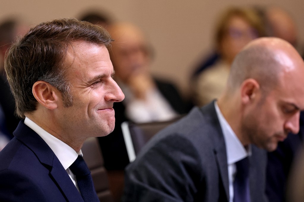 France's President Emmanuel Macron (left) reacts next to French Foreign Affairs Minister Jean-Noel Barrot during an international press conference in support of Lebanon, in Paris on 24 October (Alain Jocard/POOL/AFP)