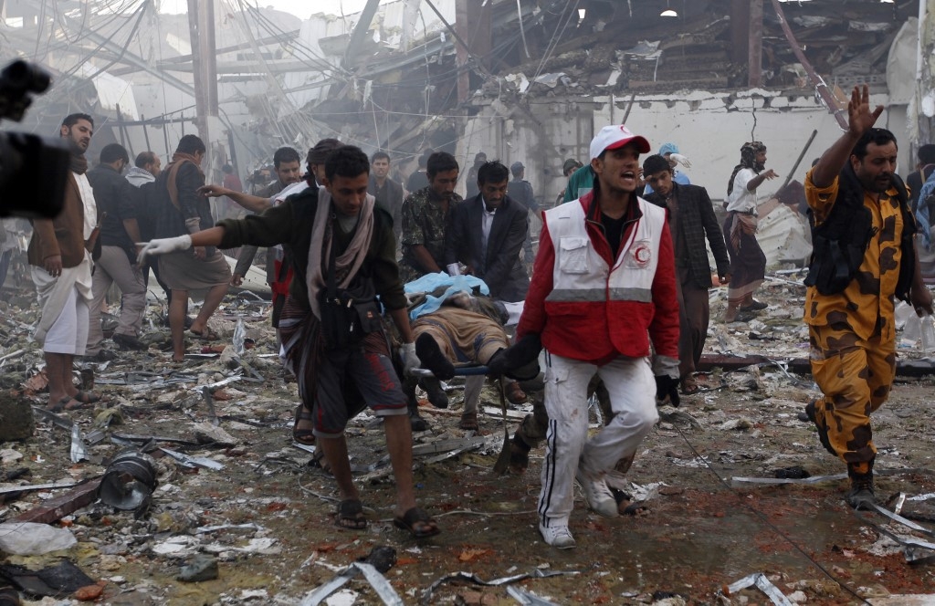Yemeni medics and rescue workers at the funeral hall in Sanaa after Saudi-led coalition airplanes bombings on 8 October 2016 (AFP) 