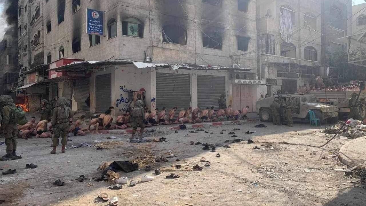 Palestinian men rounded up and stripped by Israeli forces in Gaza before being taken to an undisclosed location (Screengrab/X)