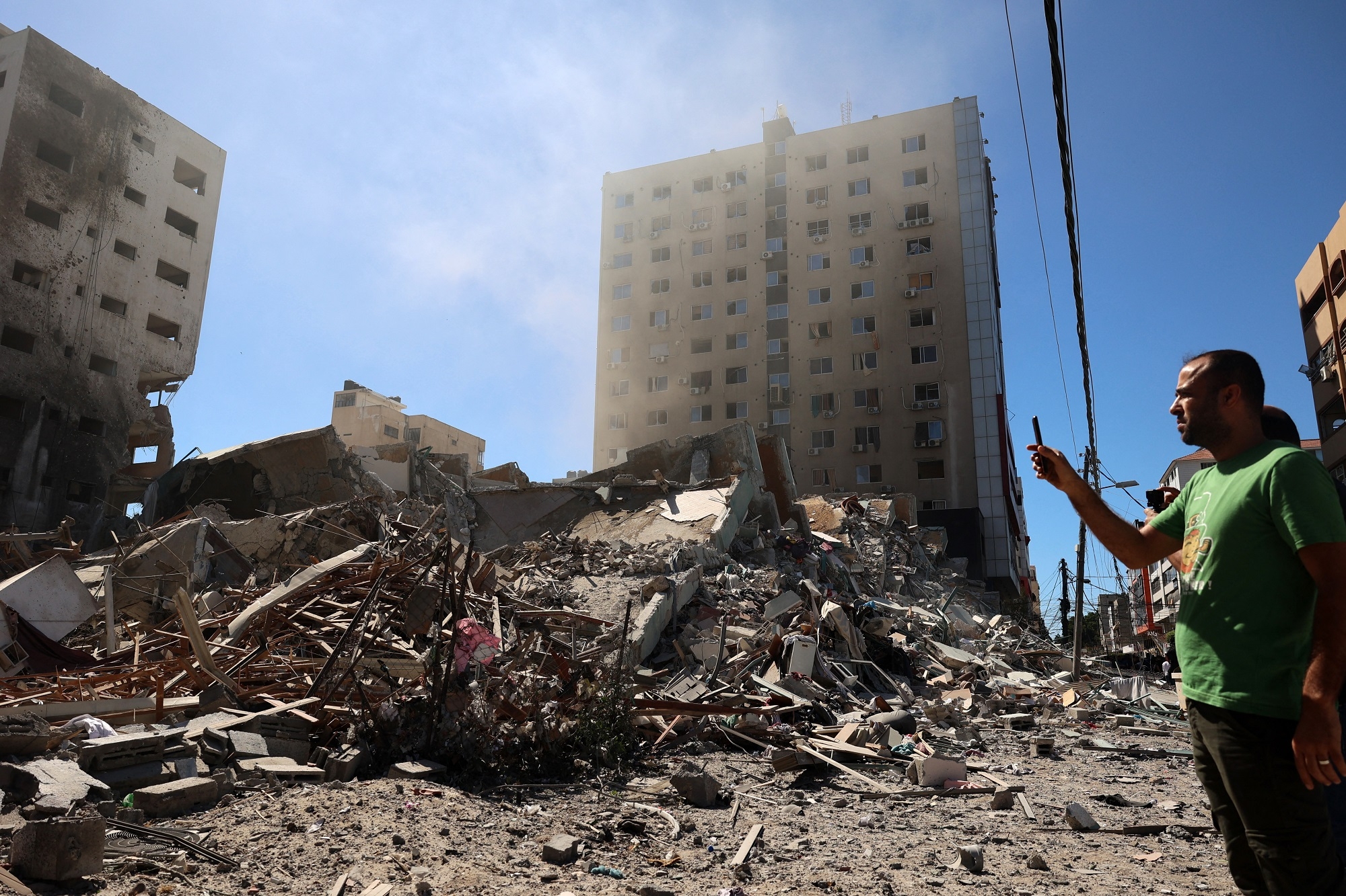 A building hit and destroyed during an Israeli air strike in Gaza City, 15 May.
