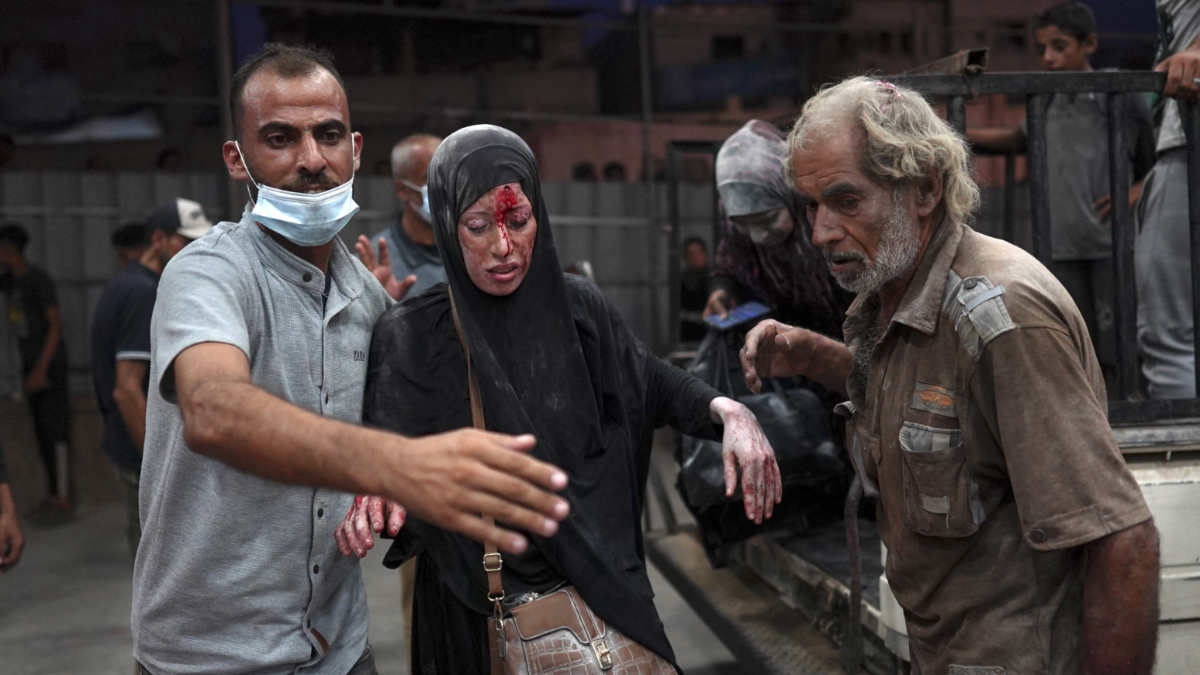 A woman injured during Israeli bombardment arrives at al-Nasser hospital in Khan Younis in southern Gaza Strip on 23 July 2024 (Bashar Taleb/AFP)