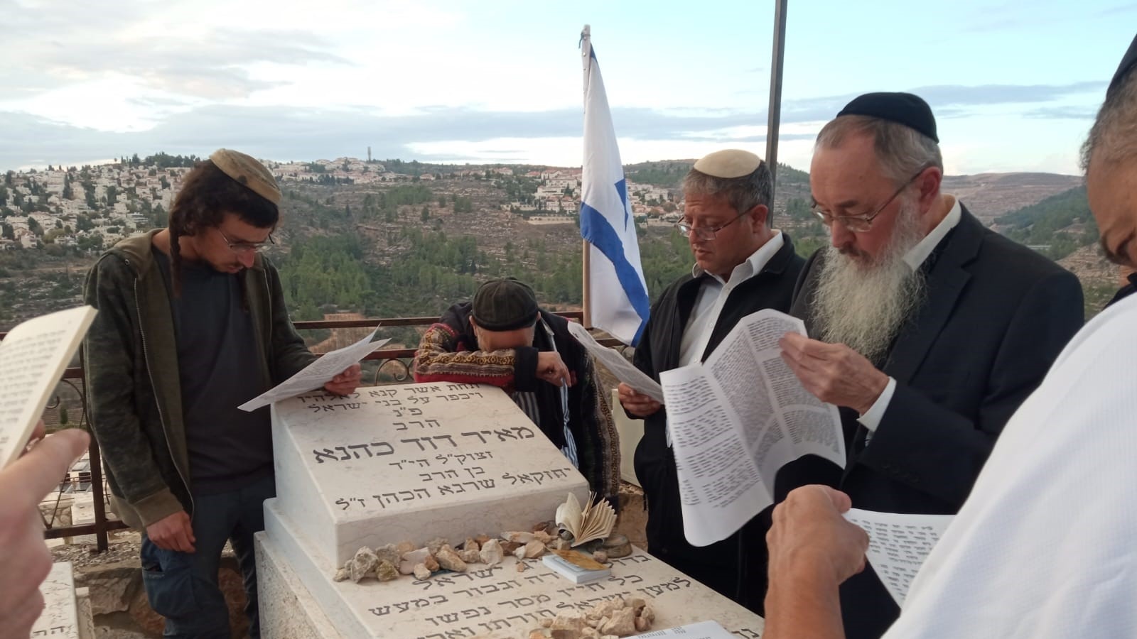 Itamar Ben Gvir and others pictured at Meir Kahane's grave in Jerusalem (X)