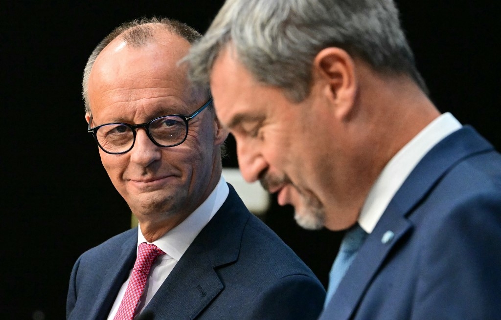 Friedrich Merz, leader of the CDU, and Bavaria's State Premier Markus Soder address a news conference on 17 September in Berlin (Tobias Schwarz/AFP)