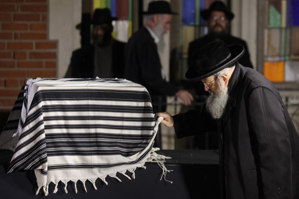 A mourner attends the funeral of Israeli-Moldovan rabbi Tzvi Kogan in Kfar Chabad, a Chabad-Lubavitch community in central Israel, on November 25, 2024. (Gil Cohen-Magen / AFP)