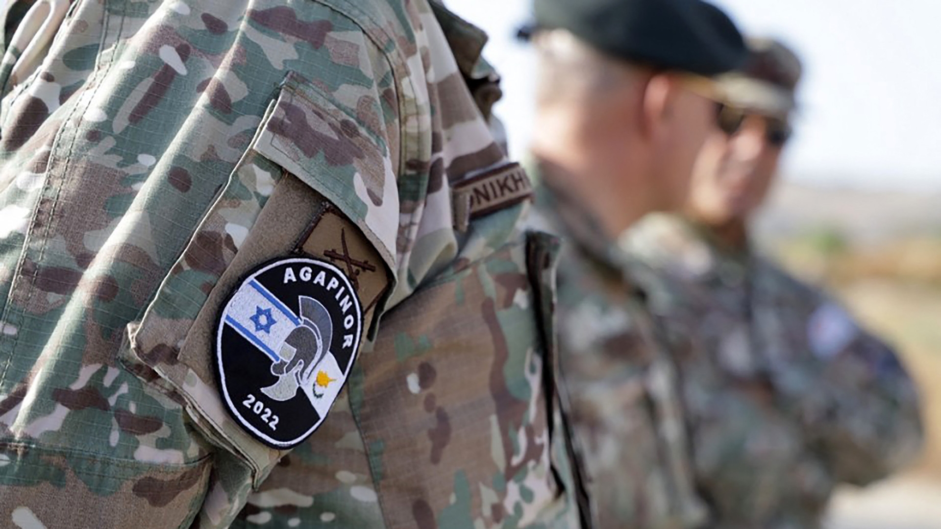 A Greek Cypriot national guardsman displays the emblem of the "Agapinor" joint military exercises with the Israeli military during drills in Cyprus on 2 June 2022 (Greek Cypriot National Guard/AFP)