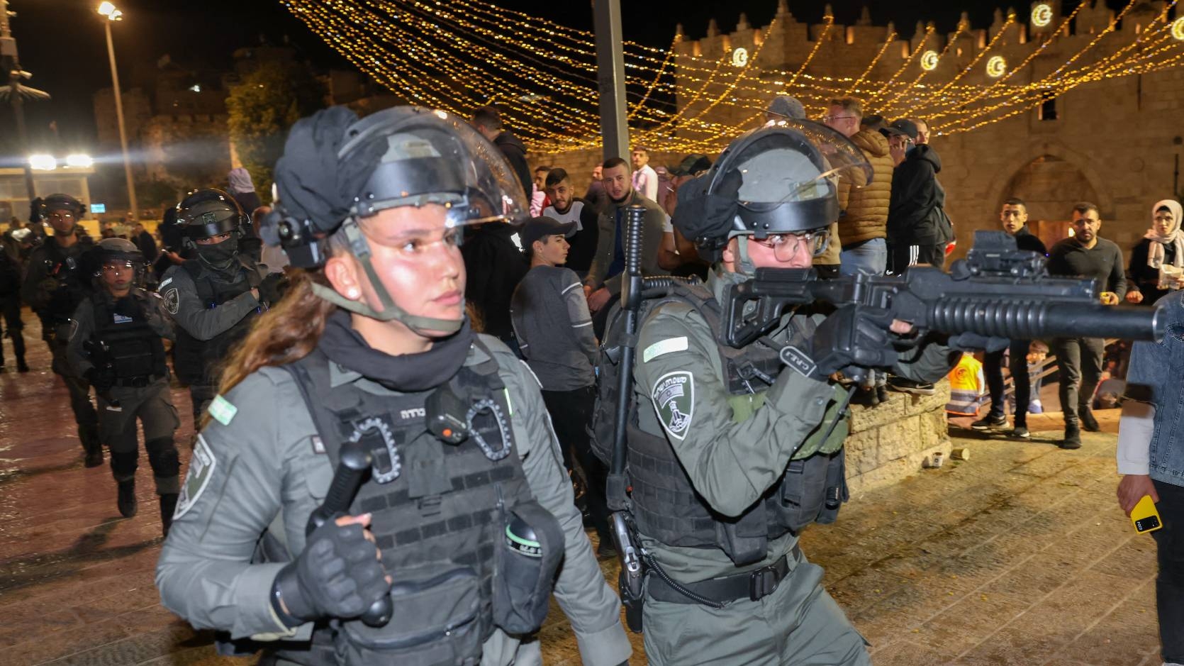 Israeli security forces gather outside the Damascus Gate in Jerusalem's Old City on April 4, 2022, during the Muslim holy month of Ramadan (AFP)