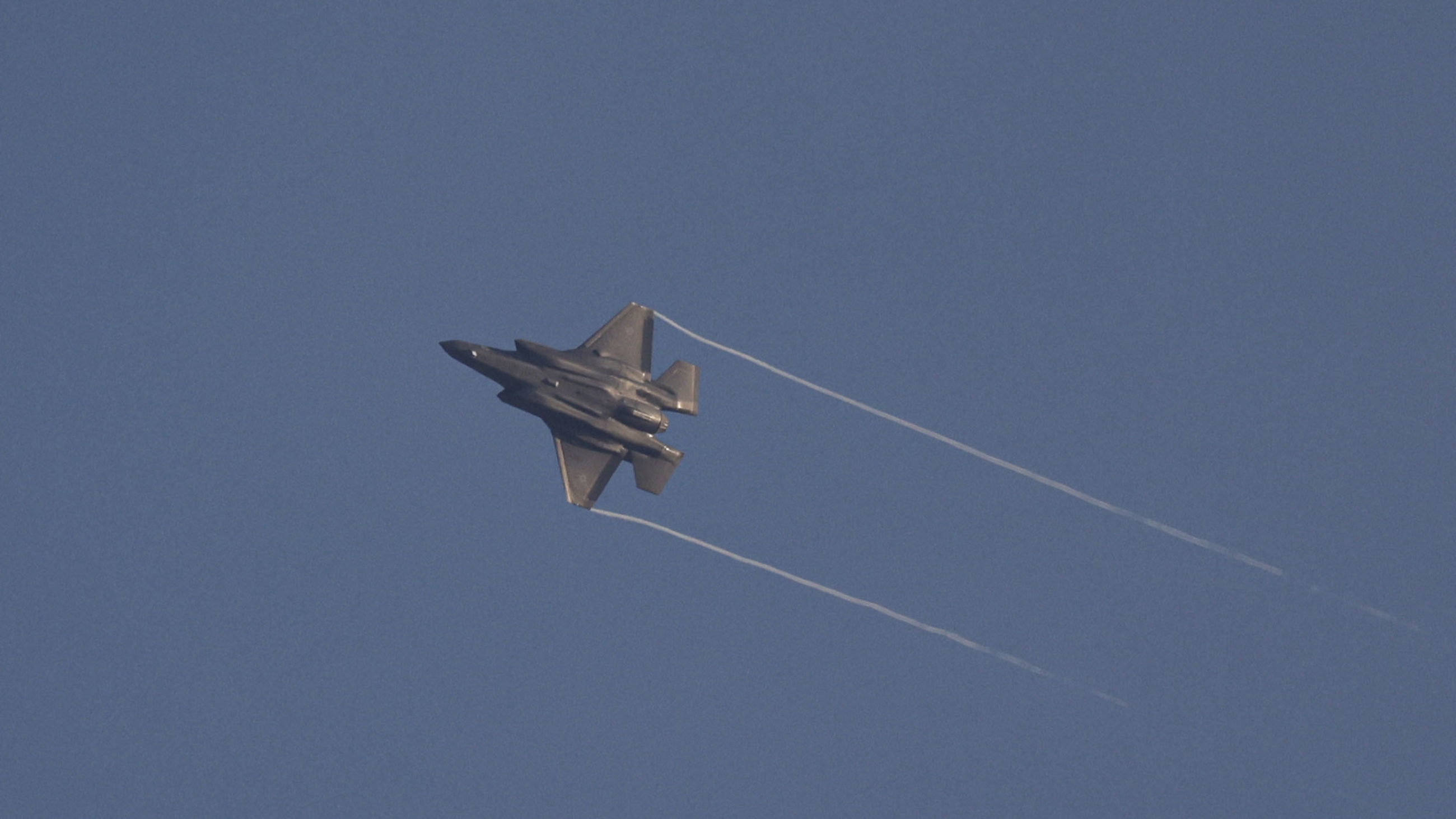 An Israeli fighter jet flying over the border area with south Lebanon on 7 July, 2024 (Jalaa Marey/AFP)